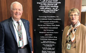 Joyce and Bill Cummings in front of plaque