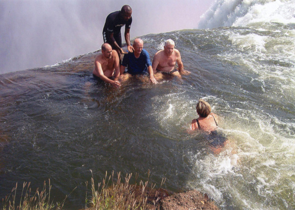 Sitting on the edge of Victoria Falls